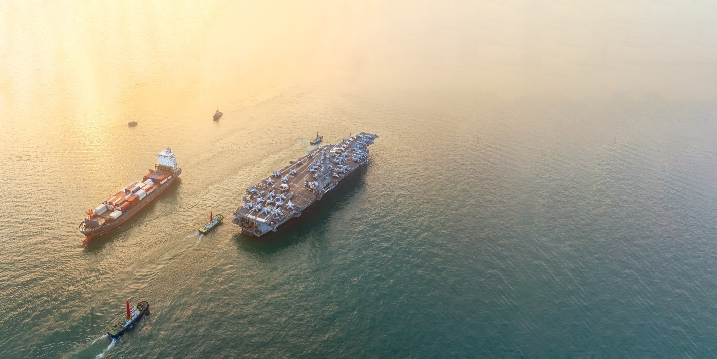 Aircraft carrier at sea representing geopolitical and market themes for War Drums report